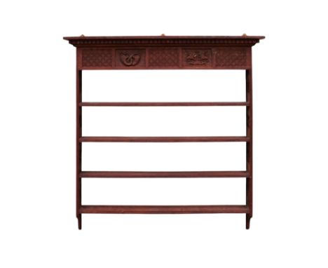 A 17th century style oak hanging shelf - the carved cornice above four shelves with pierced end supports, 125 x 126cm.