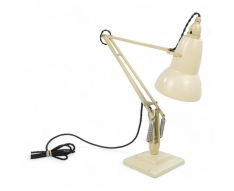 A Herbert Terry Anglepoise lamp - cream painted with a conical bell shade, on a stepped square base.