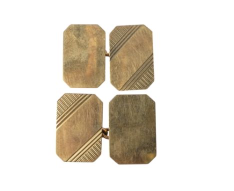 A pair of 9ct gold cuff links - rectangular with canted corners with an engine turned finish, 6.5g.