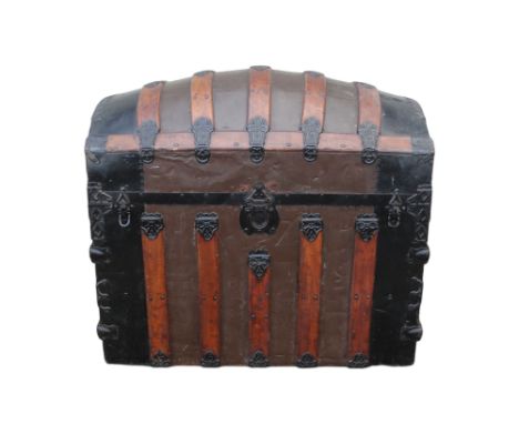 A late 19th century domed trunk - tin on a wooden frame and lathes with steel brackets, 90 x 54 x 79cm.