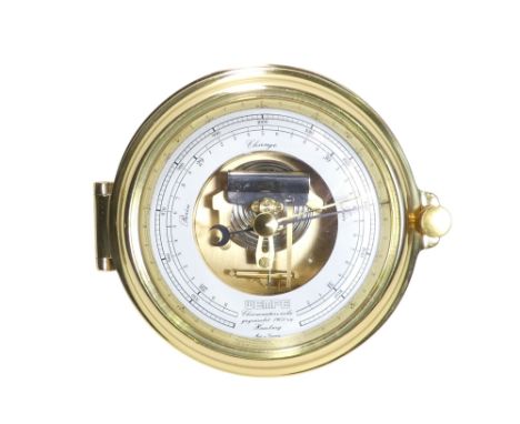A 20th century brass bulkhead aneroid barometer - with a white painted dial and exposed mechanism,18cm diameter.