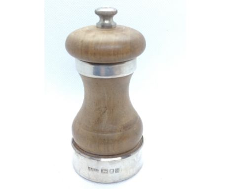 A sterling silver and hardwood pepper grinder. London Park Green &amp; Co. Ltd. 1964. 11cm high.
