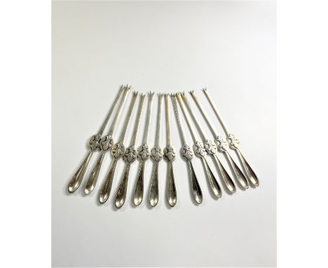 R H Tvenstrup 1893-1937. A set of twelve lobster picks. 484gms. 