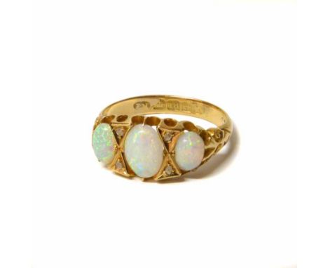 Three stone opal ring. No condition reports for this sale.