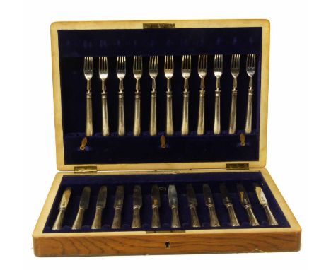 Twenty three piece silver knife and  fork set, wooden case (one missing). No condition reports for this sale.