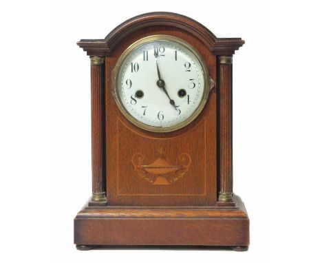 Mantle clock with oak case, two train movement. No condition reports for this sale.