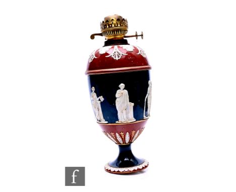 A Wedgwood Victoria Ware oil lamp, circa 1885, of ovoid form on circular spreading foot, sprigged classical figures and anthe