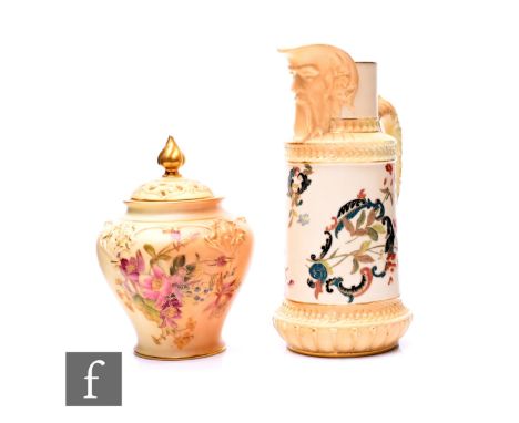 A Royal Worcester blush ivory mask jug, circa 1892, of cylindrical form with raised bands and drawn collar with moulded open-