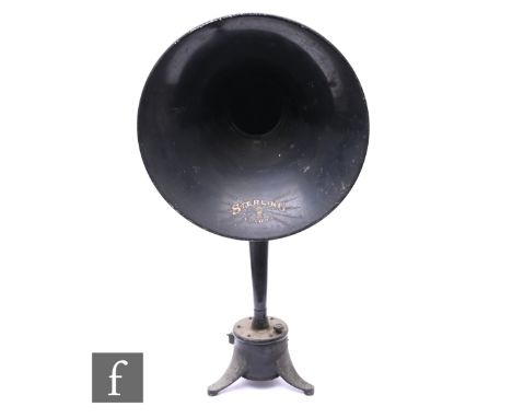 A 1920s tin plate radio horn by London Sterling, on a cast splayed tripod stand, height 68cm.