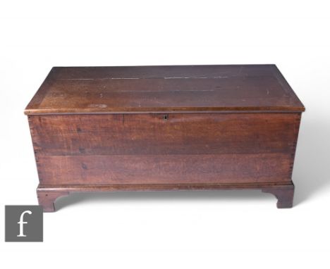 A 19th Century oak blanket chest, cleated end hinged top over a plain front, on bracket feet, height 62cm x depth 59cm x 133c
