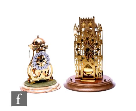 A small 20th Century skeleton clock by Thwaites and Reed on an onyx circular base under a glass dome, height 20cm, and a simi