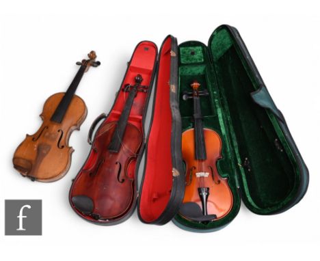 An early 20th Century violin, length 36cm, cased, a similar violin, labelled, and another labelled Antoni, two cased. (3)