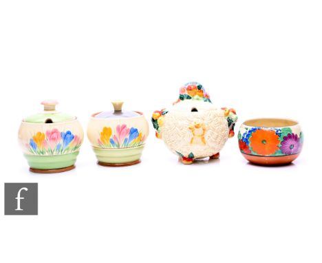A Clarice Cliff preserve pot circa 1938, hand painted in the Spring Crocus pattern with Crocus sprays with green and brown ba