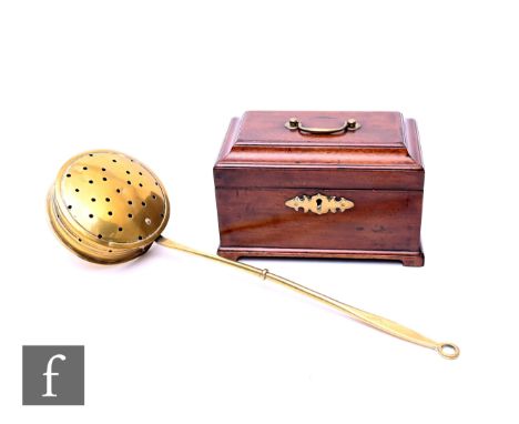 A George III mahogany tea caddy of sarcophagus form, lacking interior, width 24cm, and a brass chestnut roaster. (2)