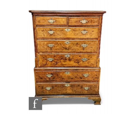 An 18th Century walnut feather and crossbanded chest on chest, the upper section fitted with two short and three long drawers