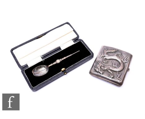 An early 20th Century Chinese white metal cigarette case, both sides embossed with chasing dragons, and a small Gothic spoon.