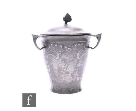 A Kayserzinn Arts &amp; Crafts three handled pewter biscuit barrel and cover, with triangular shaped finial and relief stylis