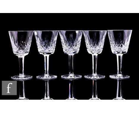 A group of five Waterford crystal Lismore pattern wine glasses on panelled stems, all with acid etched marks, height 15cm. (5