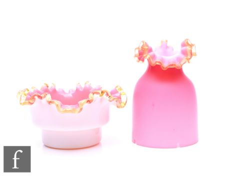 A Victorian glass night light with straight sided base in opal with pink interior with applied amber crimped rim, with simila