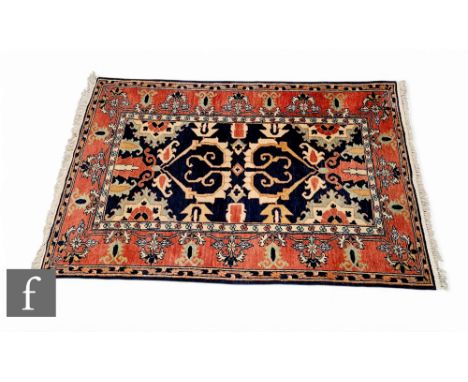 A Fereghan rug, the central design within a rectangular panel on a blue ground within a trailing floral multi border, 190cm x