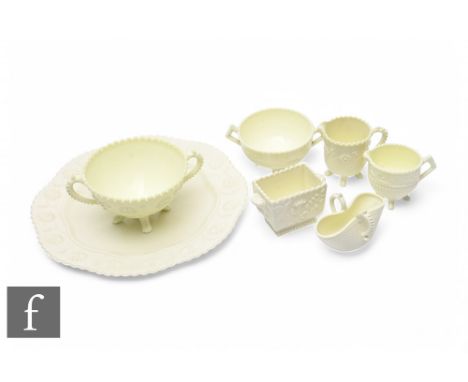 A group of late Victorian Sowerby Queen's Ivory Ware pressed glass, including a strawberry jug and bowl set with peacock desi