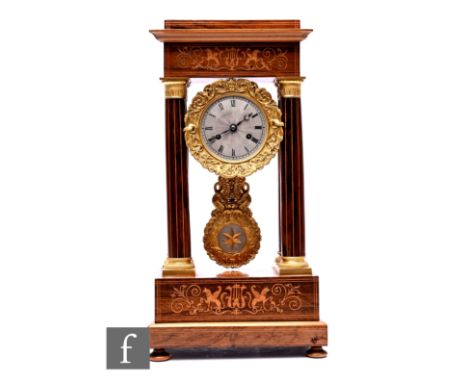 A 19th Century Portico clock, the silvered suspended dial within marquetry inlaid classical pillar frame, decorated with acan