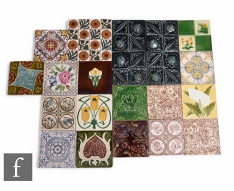 A collection of 19th Century 6 inch dust pressed tiles, relief moulded, printed and faux tube lined florals, including a pair