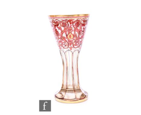 A 'Lobmeyr' Bohemian enamelled glass vase, circa 1900, of trumpet form on facet cut stem and circular foot, gilt heightened e