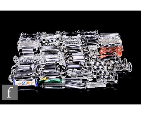 A collection of 19th and 20th Century clear crystal knife rests, of assorted designs and shapes, including sets and pairs, wi