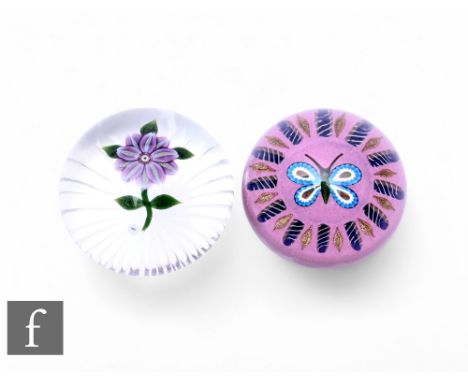 A contemporary William Manson glass paperweight of domed form, internally decorated with a stylised butterfly surrounded by a
