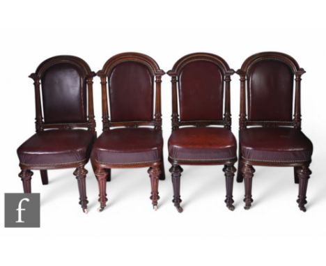 A set of four 19th Century standard chairs in the Gillows style, the moulded arched pillar backs upholstered in beaded edge m