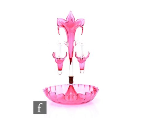 A 20th Century cranberry glass epergne with single fluted with petal shaped rim, with two applied clear hooks with two simila