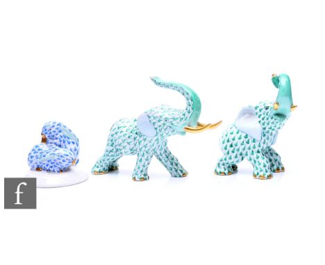 A Herend porcelain Elephant, modelled with raised trunk, green fishnet decoration with gilt highlights, height 9.5cm, another