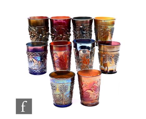 A group of Carnival glass tumblers including Northwood Acorn Burrs, Fenton Orange Tree Orchard, Dugan Stork and Rushes, North