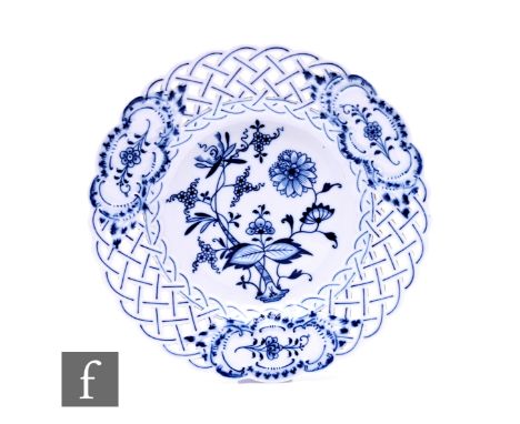 A Meissen 'Blue Onion' pattern comport, of reticulated circular form, on circular foot, decorated with flowering tree within 