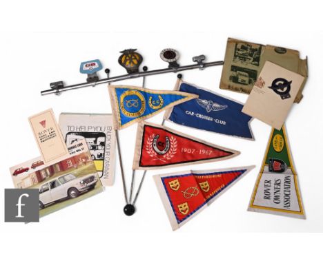 A car chrome bar mounted with an AA badge, a GB Les Amis D' outre Manche badge, a caravan club enamel badge, three cloth penn