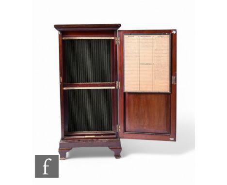An early 20th Century mahogany 'Disque' record cabinet by Imhof &amp; Mukle, with crossbanded door and raised to bracket feet