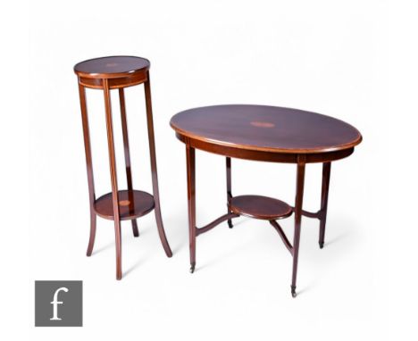 An Edwardian satinwood crossbanded and line inlaid oval occasional table, the top detailed with fan paterae on slender legs u