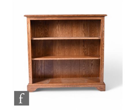 A Victorian style oak open bookcase, adjustable shelves on bracket plinth base, height 96cm x depth 28cm x width 100cm.