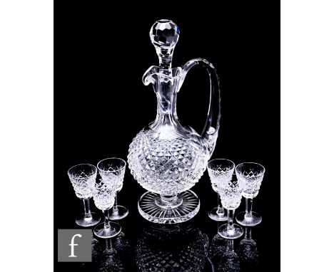 A Waterford crystal Alana pattern liqueur set, comprising of jug of rounded form on round base with facetted stopped, height 