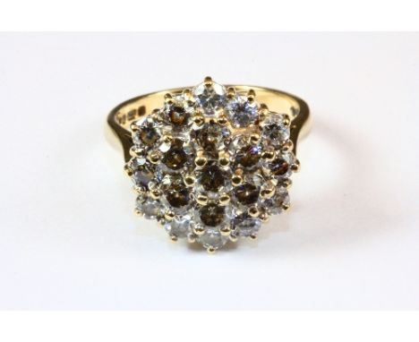 A heavy 9ct yellow gold cubic zirconia cluster ring (O).