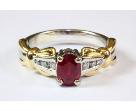 A heavy quality 14ct yellow and white gold ring set with a ruby and diamonds, (N).