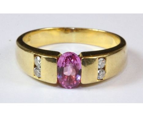 An 18ct yellow gold pink sapphire and diamond ring, (K).