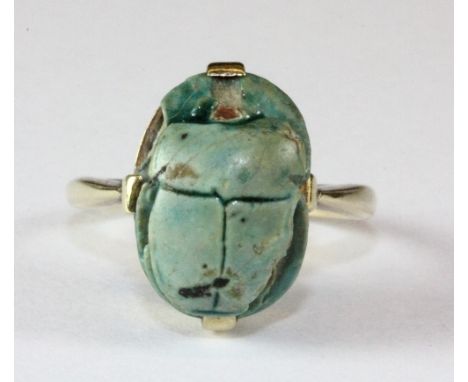 A 14ct yellow gold scarab ring (J).