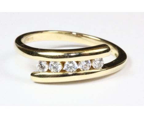 A 9ct gold stone set crossover ring, (P).