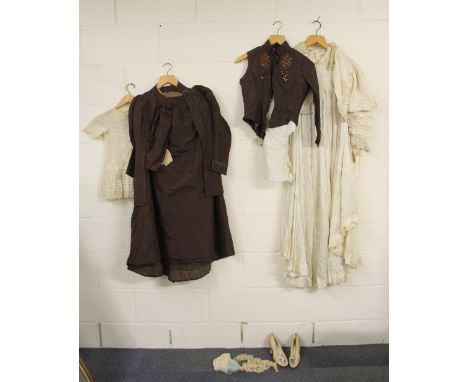A Victorian ladies silk coat, blouse, under skirt, skirt and waist coat with silk shoes