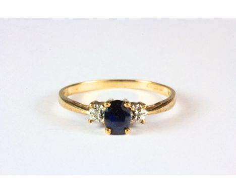 A 9ct yellow gold sapphire and diamond ring (L).