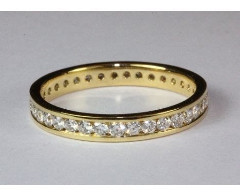 An 18ct yellow gold full eternity ring set with approximately 1ct of diamonds, (O).