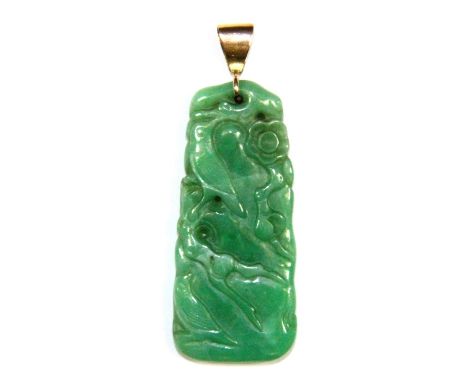 A superb 19th century Chinese carved green jade pendant in the form of blossoms on a tree with later yellow metal (tested gol