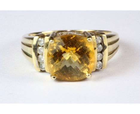 A heavy 9ct gold ring set with a large citrine and diamonds, (S.5).